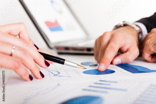 Photo: Business people discussing during a meeting Business people discussing during a meeting