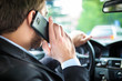 Man talking on the phone on his car