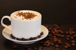 Latte on wooden table on brown background