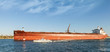 Tanker passes through the Suez Canal with pilot boat