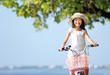Photo: girl riding bike outdoor girl riding bike outdoor