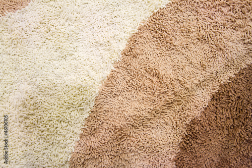 Photo: A beige carpet texture, close-up A beige carpet texture, close-up
