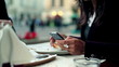 Businesswoman with cellphone eating bruchetta, outdoor 
