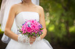 Bride with pink and purple wedding bouquet