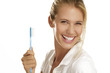 young woman showing teeth brush