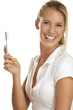 young woman showing teeth brush