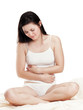 Pretty young woman has abdominal pain - isolated