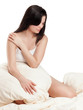 Pretty young girl dreaming in bed - isolated