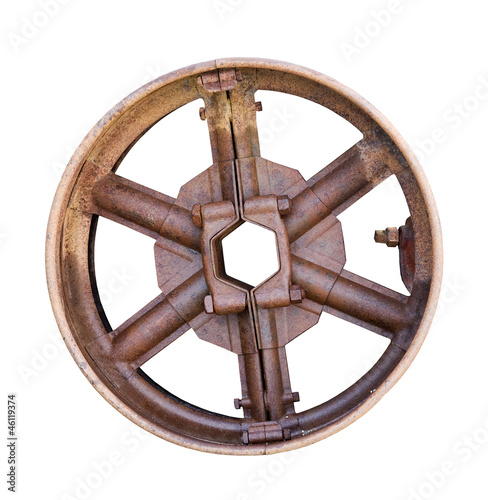 Photo: antique metal wheel drive on a white background antique metal wheel drive on a white background