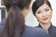 Asian Chinese Woman or Businesswoman in Meeting