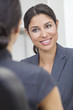 Hispanic Latina Woman or Businesswoman in Office Meeting