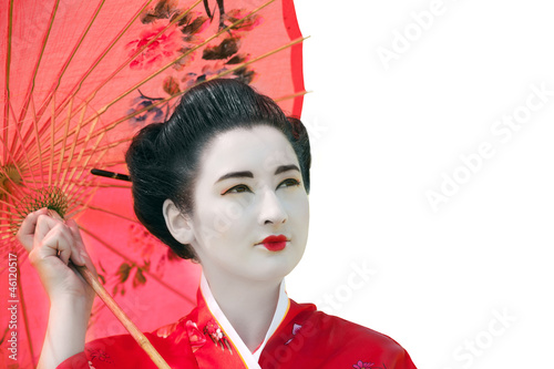 Photo: Geisha with umbrella looking up, isolated Geisha with umbrella looking up, isolated