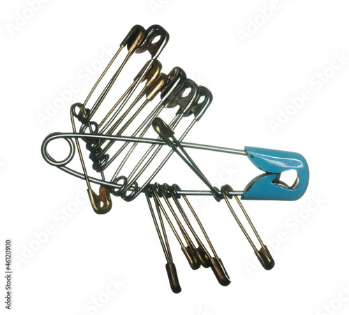Photo: Linked safety pins on white backgound Linked safety pins on white backgound