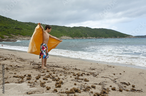Photo: portrait of little boy on the beach portrait of little boy on the beach