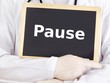 Doctor shows information on blackboard: pause