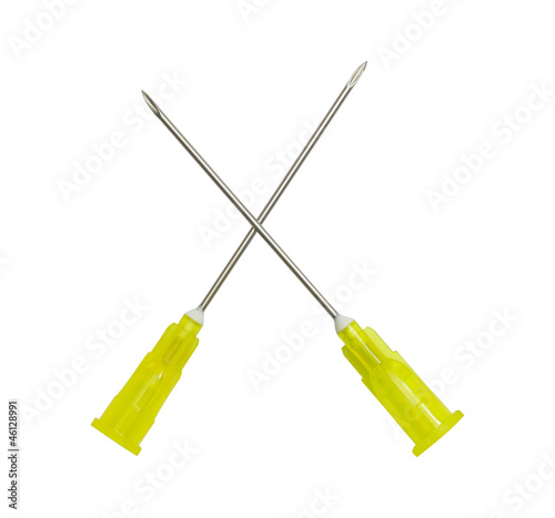 Photo: two medical needles cross. Isolated on white. two medical needles cross. Isolated on white.