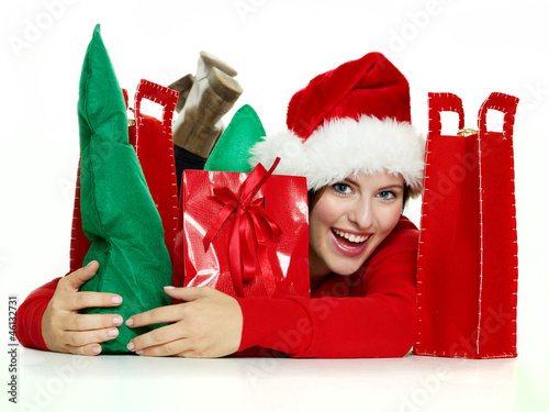 Photo: Miss santa lies on the floor, retains a lot of Christmas gifts Miss santa lies on the floor, retains a lot of Christmas gifts