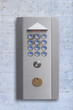 Intercom doorbell panel on stone doorway, isolated