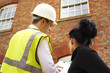 Surveyor or builder and homeowner discussing property issues