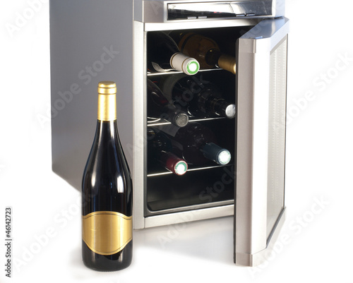 Photo: Wine refrigerator and bottle of red wine Wine refrigerator and bottle of red wine