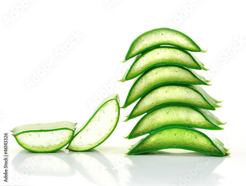 Photo: aloe vera fresh leaf. isolated over white aloe vera fresh leaf. isolated over white