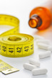 Diet pills and measuring tape