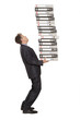 Frustrated businessman looking at pile of file folders