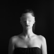 Photo: Close up of woman constrained by gauze ring on eyes. Close up of woman constrained by gauze ring on eyes.