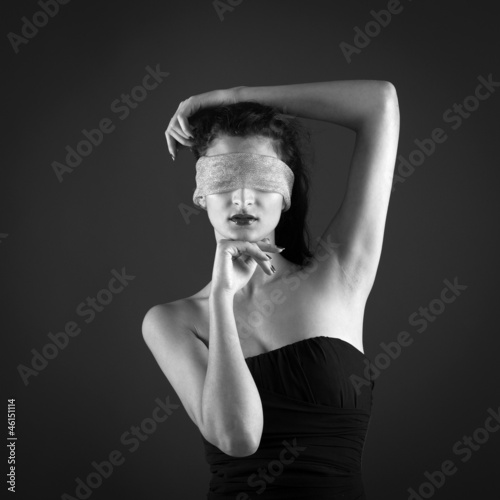 Photo: Close up of woman constrained by gauze ring on eyes. Close up of woman constrained by gauze ring on eyes.