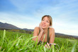 Photo: Beautiful woman listening to music in natural field Beautiful woman listening to music in natural field