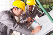 two textile workers checking fabrics quality on QC table