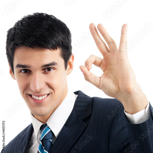 Photo: Businessman with okay gesture, isolated Businessman with okay gesture, isolated