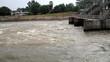 whirlpool flowing on hydroelectric power station dam