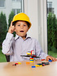 Photo: Portrait of handsome boy posing at home with lego Portrait of handsome boy posing at home with lego