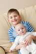 Foto: Two brothers smile. Two brothers smile.
