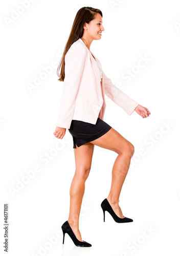 Photo: Business woman climbing stairs Business woman climbing stairs