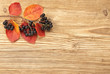 Black chokeberry on a wooden background