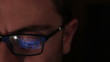 Facebook on glasses: man using a laptop to surf on facebook