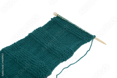 Photo: Scarf on knitting needles in stocking and garter stitch Scarf on knitting needles in stocking and garter stitch
