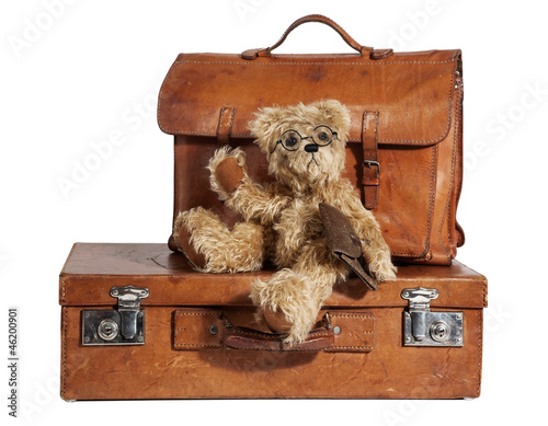 Photo: Well-Traveled Vintage Suitcase and Teddy Bear Well-Traveled Vintage Suitcase and Teddy Bear