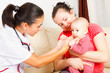 Pediatrician checking a baby