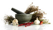 dried herbs in mortar and vegetables, isolatrd on white