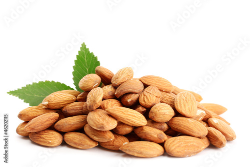 Photo: tasty almonds nuts with leaves, isolated on white tasty almonds nuts with leaves, isolated on white