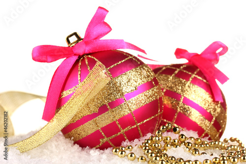 Photo: beautiful bright Christmas balls on snow, isolated on white beautiful bright Christmas balls on snow, isolated on white