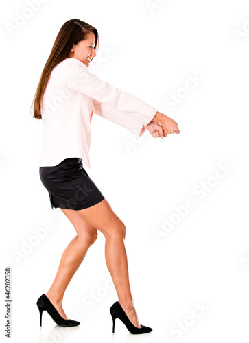 Photo: Business woman pulling something Business woman pulling something