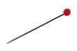Eine Stecknadel mit rotem Kopf