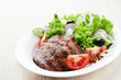 Grilled steak with fresh vegetables on a plate