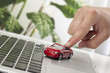 hand playing a toy car