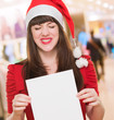 upset christmas woman holding a blank card