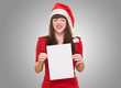 upset christmas woman holding a blank card